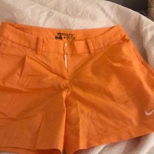 Orange Nike golf shorts